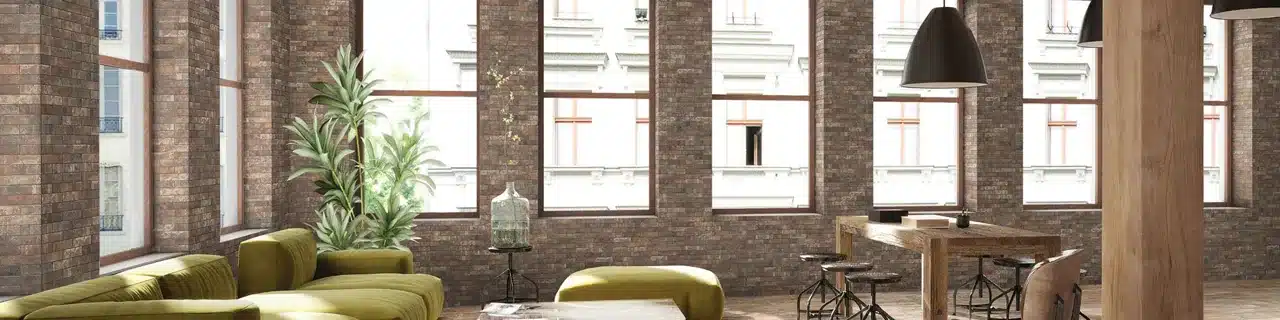 Daltile Brickwork Terrace brick-look porcelain walls around tall windows in a manufacturer living room scene