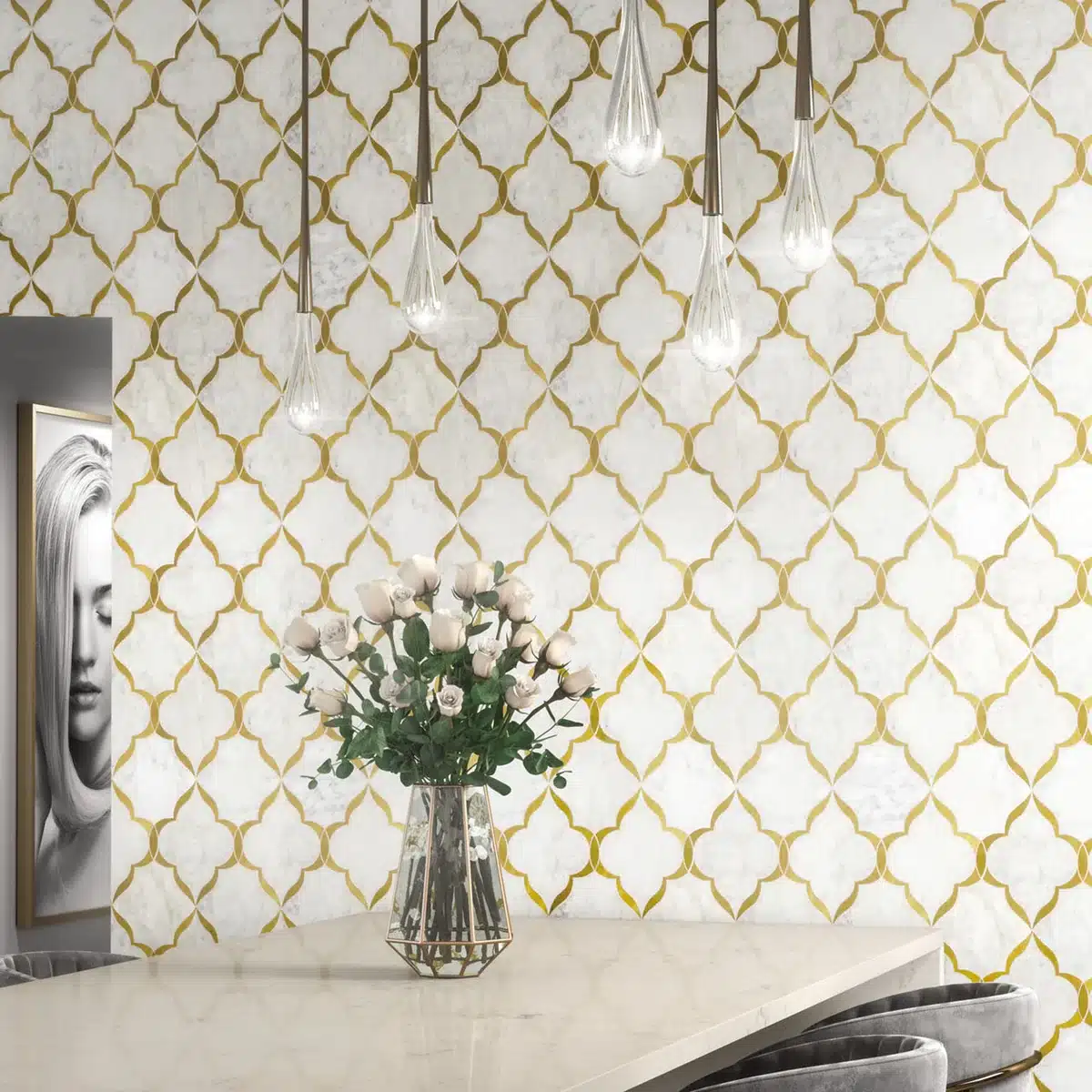 Daltile Lavaliere Carrara White and Brass Kapali mosaic wall beside pendant lights and a table in a manufacturer interior scene