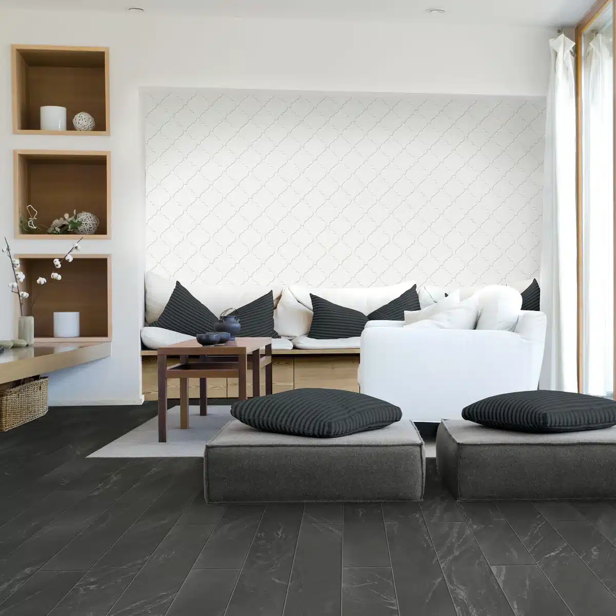 Daltile Mythology Santorini white arabesque ceramic wall tile behind a seating area in a manufacturer living room scene