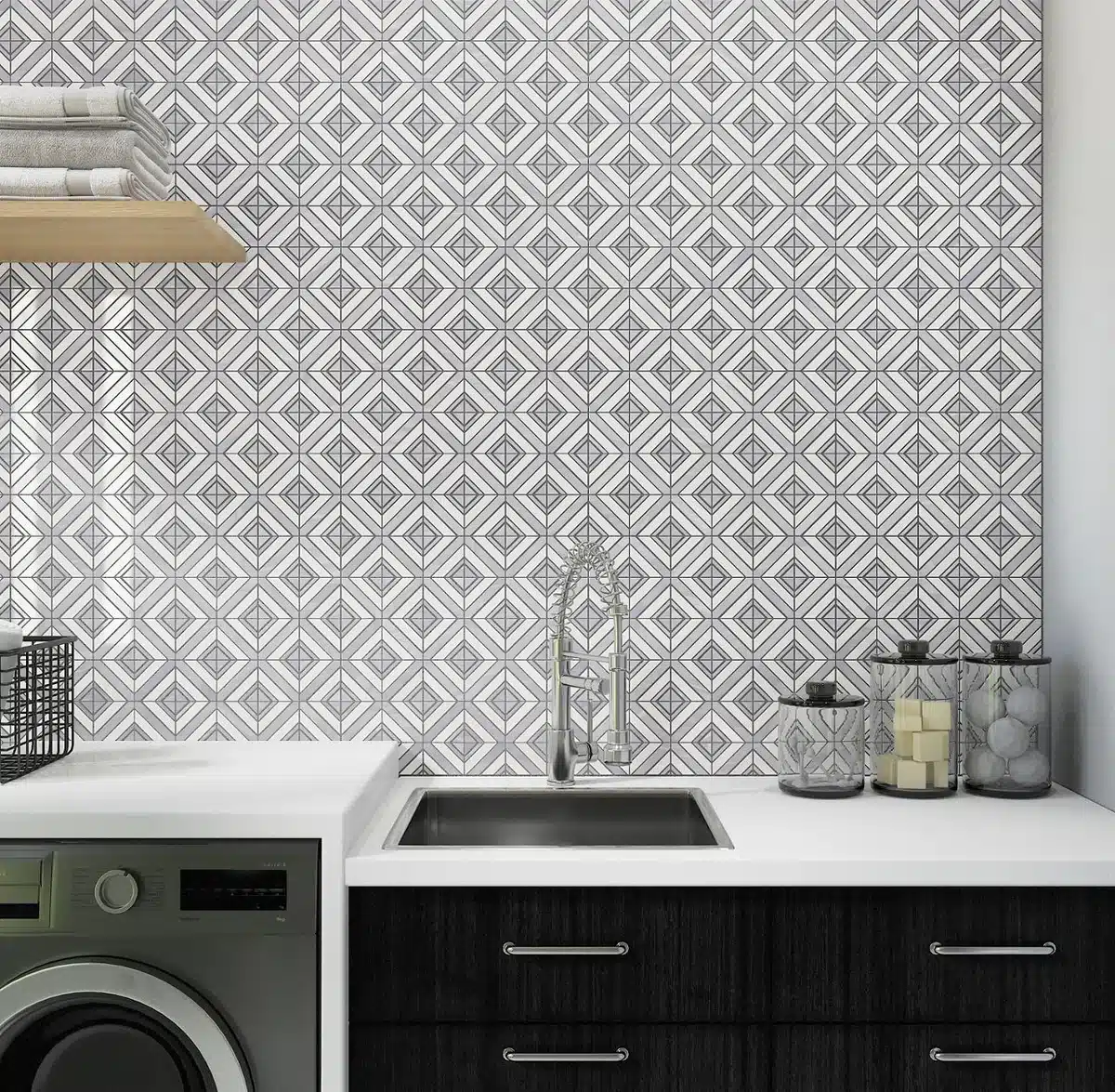 Daltile Perfit Mosaix Grey Palissandro and Thassos Maze marble backsplash above a sink and washing machine in a manufacturer laundry room scene