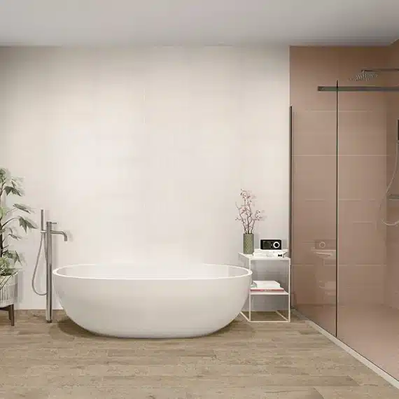 Daltile Rigid Clay textured ceramic wall tile behind a freestanding white bathtub in a manufacturer bathroom scene