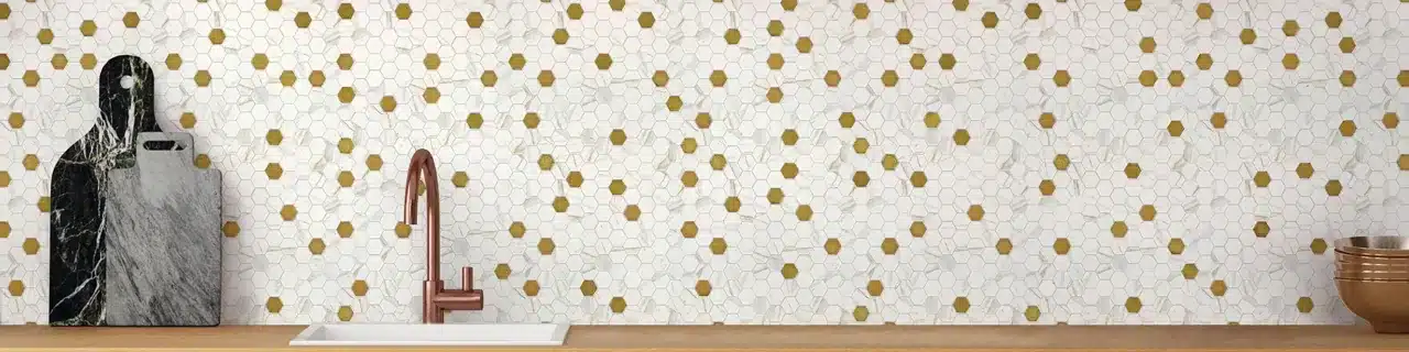 Daltile Uptown Glass Posh Chiffon hexagon mosaic backsplash above a kitchen sink in a manufacturer room scene