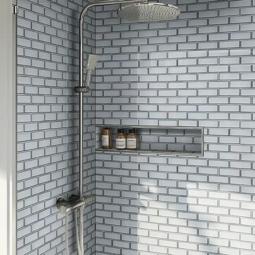 MSI Bevello Ice Bevel glass subway tile around a shower niche and chrome fixtures in a manufacturer bathroom scene