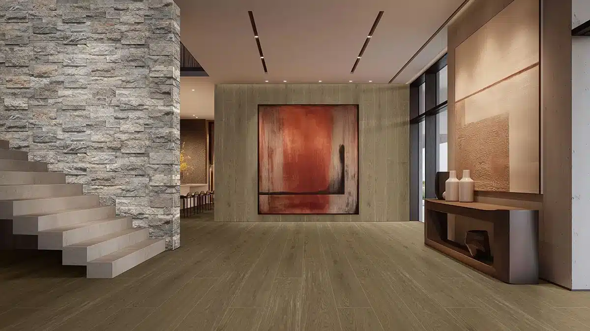 MSI Cabana Honey wood-look porcelain floor beside a staircase and red artwork in a manufacturer interior scene