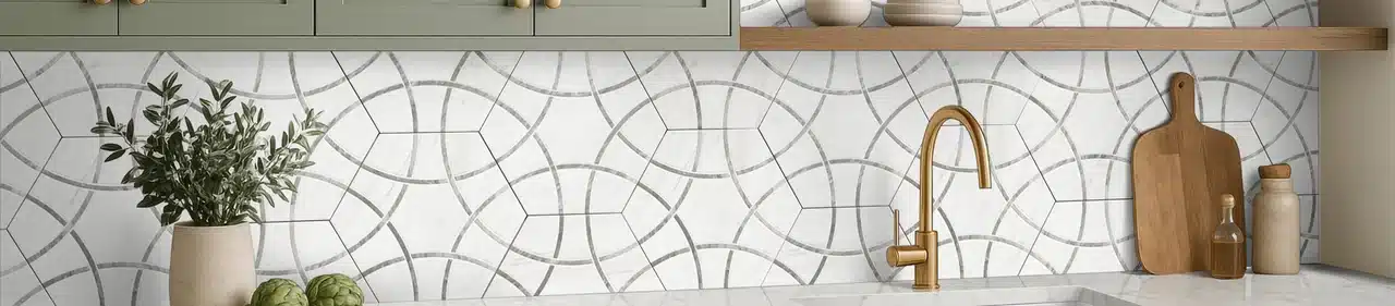MSI GeoGlam patterned porcelain backsplash beneath green kitchen cabinets and a wood shelf in a manufacturer scene