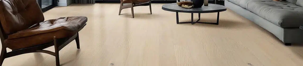 MSI Kelmore light engineered hardwood floor beneath a leather chair and beside a gray sofa in a manufacturer living room scene