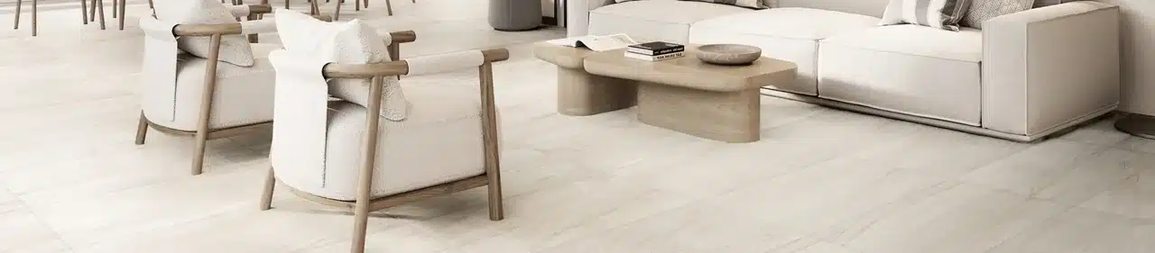 MSI Malahari light quartzite-look porcelain floor tile beneath cream seating in a manufacturer living room scene