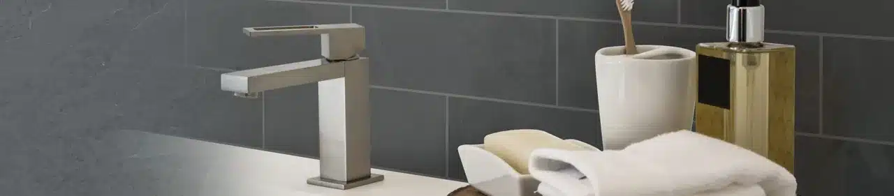 MSI Montauk Black slate subway backsplash behind a bathroom vanity faucet in a manufacturer scene