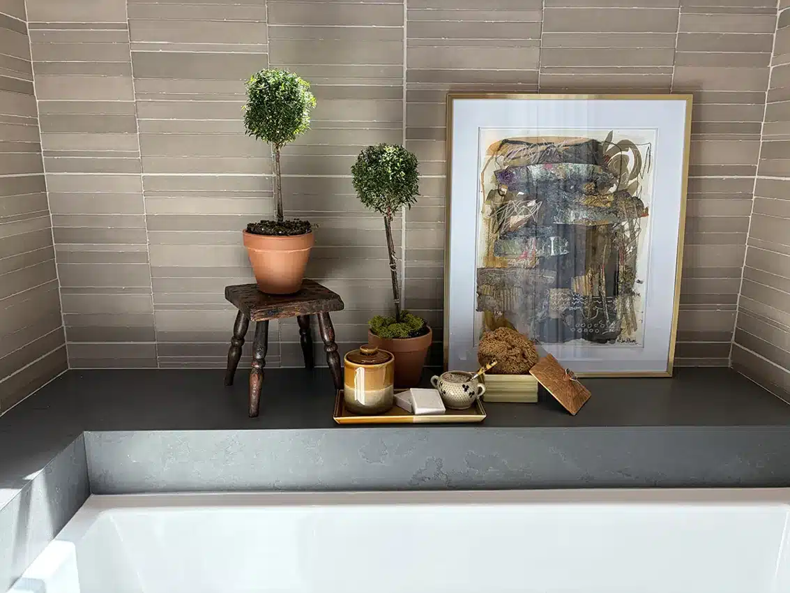 MSI Murcia Clay Origin dimensional ceramic wall tile above a bathtub in a manufacturer room scene